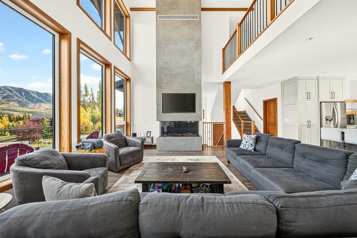 Living room with sectional sofas and mountain views